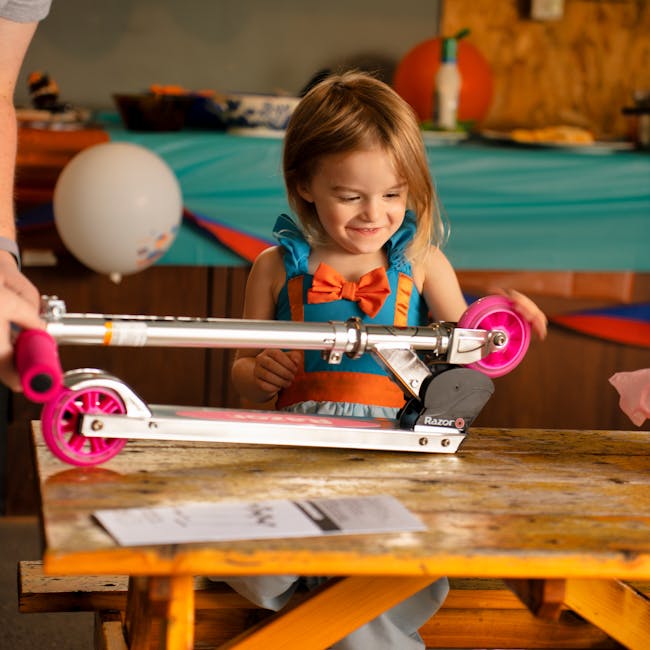A happy child receiving a colorful scooter as a gift, smiling with excitement for Geschenke für 5-Jährige